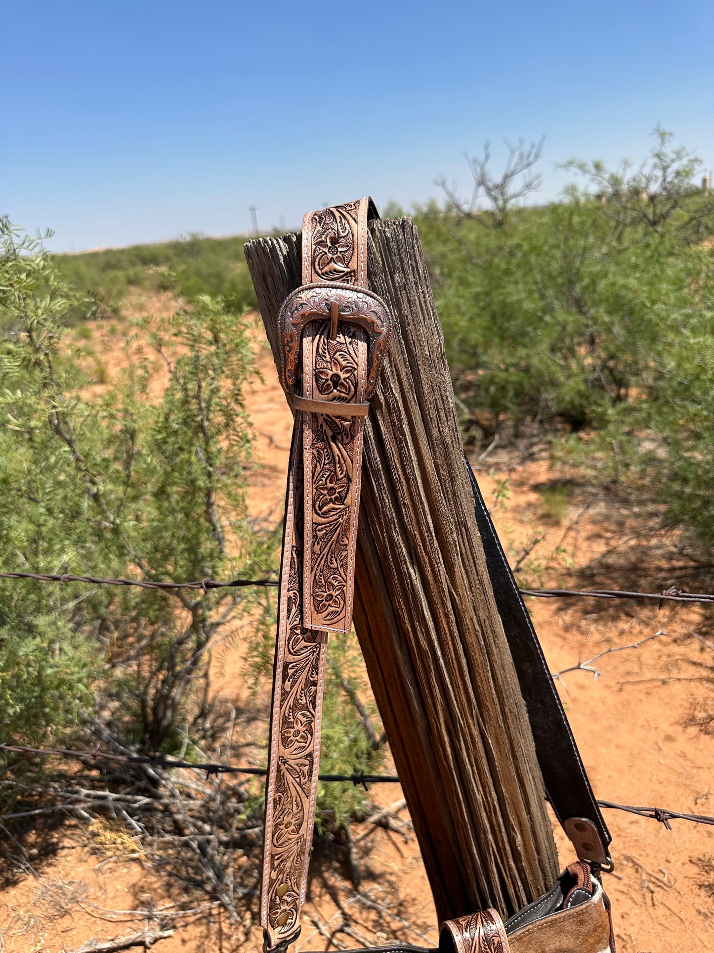 Cowhide Crossbody with Fringe and Emblem